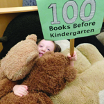 stuffed animal and girl who read 100 books