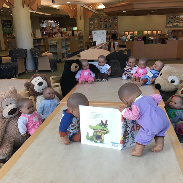 In the early morning hours, the EPL babies decided to host their own Saturday morning storytime. #elmhurstil #libraryshenanigans #babieslovereading