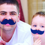 dad and kid with fake mustaches